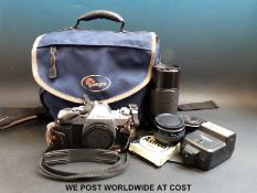 A Canon AL-1 camera and accessories including spare lenses