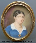 A portrait miniature of a lady in period dress with ruby pendant,