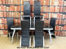 A contemporary glass and metal dining table and eight chairs (H75 x W166 x D90cm)