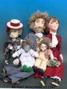 Three dolls in Victorian/Edwardian style clothing together with two hedgehogs in period clothing