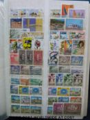 A large stockbook of mainly Middle East and West African countries and a ring binder of South