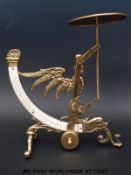 A brass postage scale with curved double scale,