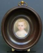 A portrait miniature of a small blonde girl,