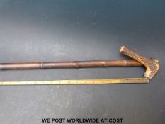 A horse measuring stick walking cane with boxwood measure inside