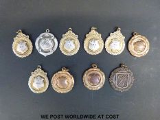 A collection of Finsbury Park cycling time trial medals dated 1953 marked verso with time,