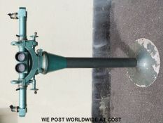 A floor mounted sight, possibly for surveying use, each side being a different magnification.
