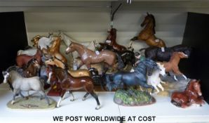A collection of nineteen various ceramic horses to include Wade, Border Fine Arts, Goebel,