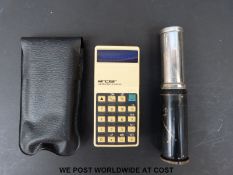 An Otis King spiral slide rule and vintage Sinclair calculator