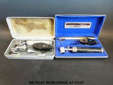 Two cased c1960 / early 70s Keeler auroscopes / opthalmoscopes