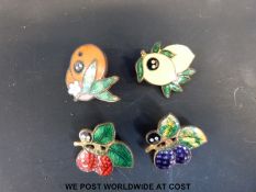 Four pre-war Robertson's Golly fruit badges