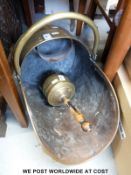 A brass coal scuttle and matching shovel