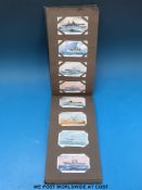 A collection of cigarette card albums including Godfrey Phillips aircraft, John Player aircraft,