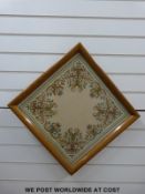 An oak framed embroidery or tapestry