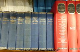 Book stand with books with works by Charles Dickens and three works of reference