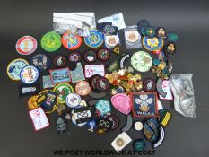 A large collection of Girl Guide cloth and metal badges