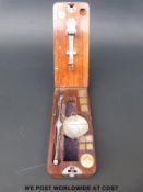 A cased set of Calipe Dettmer & Co travelling diamond scales with fold out mechanism,