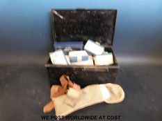 A WWII ARP warden's first aid case together with a field torniquet and canvas limb sling in London