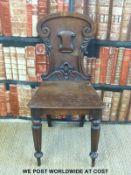 A 19thC mahogany shield back hall chair
