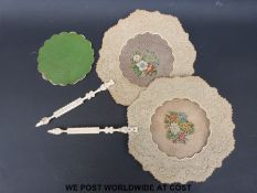 A pair of ivory handled pressed paper face screens