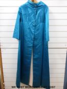 A vintage blue evening dress and matching coat in heavy blue satin with related newspaper clipping