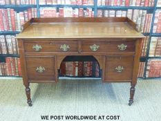 A 19thC mahogany desk with two over two drawers raised on castors (H80 x W120 x D62cm)