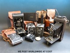 A quantity of collectable cameras to include folding cameras, a 'Miniature Bisley' telescope etc (7.