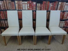 Four cream leather modern dining chairs