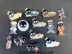 A collection of enamel Golly badges including various Robertson Collector badges, sailor,