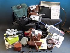 A collection of various cameras and accessories mainly in cases to include Voigtlander Vito B,