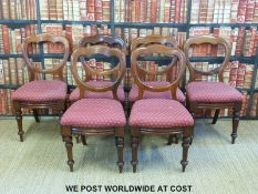 A set of six 19thC upholstered mahogany dining chairs with turned legs