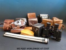 A quantity of binoculars and cameras including vintage 8x zoom,