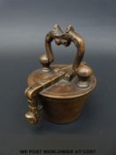 A cased set of Nuremberg style nesting cup weights with handle to lid and stamped N16 and with