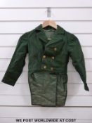 A middle eastern ladies dress with lotus flower decoration and pearl clasps together with a child's