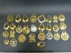 Approximately 20 late 19thC / early 20thC and later horse brasses including stars with raised