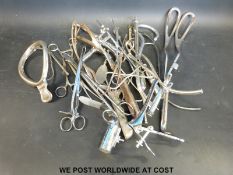 A collection of largely midwifery and obstetric instruments including delivery forceps, speculum,