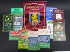 A signed Aston Villa pennant for 2005-2006 season and a quantity of football programmes.