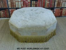 A large octagonal upholstered pouffe with fringed edge (H40 x W 106 x D106cm)
