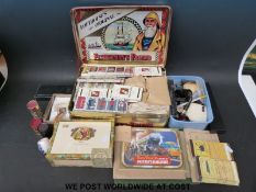A collection of pipes, cigarette lighters, cigarette cards,