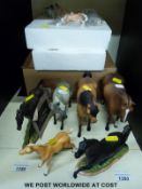 A collection of resin and ceramic horses including a boxed Wade North Light horse and foal