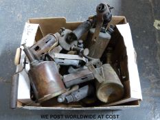 A collection of brass and other blow torches,