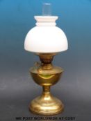 A brass twin burner oil lamp