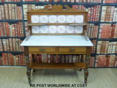 A satin walnut marble topped tile backed washstand (H129 x W108 x D49cm)