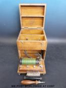An early 20thC electrical therapy machine complete with comb and rod attachments,
