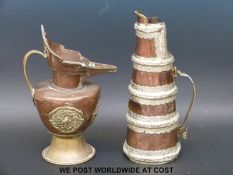 Two Tibetan copper jugs, one with banded white metal mounts,