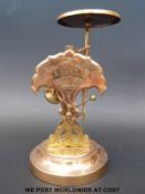 A set of brass/bronze postage scales with pendulum type swinging weight / dial design