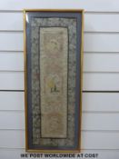 A framed, possibly 19th century embroidery featuring flowers,