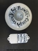 A Flower of Cuba cigars match striker together with a further wall mounted match striker