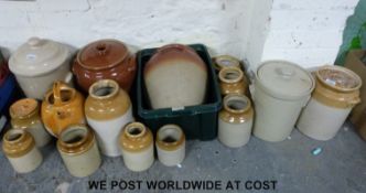 A collection of stoneware jars some with lids