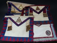 A Knight's Templar gown and cloak together with a collection of Masonic aprons from lodges in