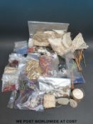 A collection of lace, beads, embroidery items,
